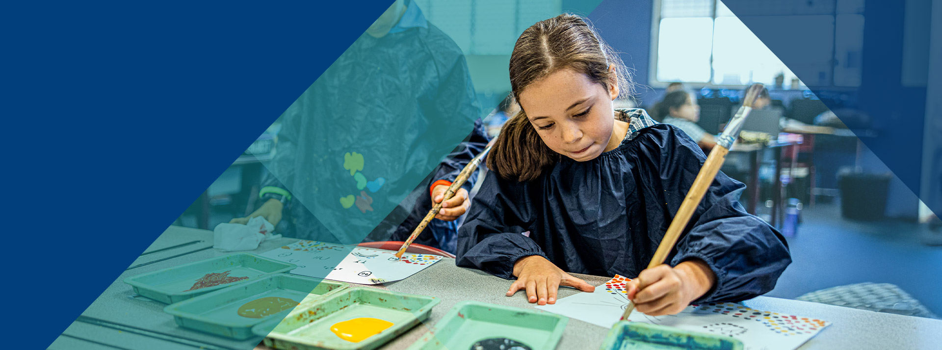 Student painting in the classroom at Our Lady of Lourdes Primary School Baulkham Hills South