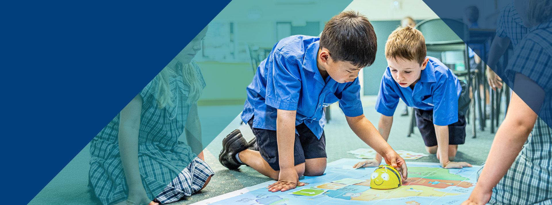 Students programming a bee bot in the classroom at Our Lady of Lourdes Primary School Baulkham Hills South