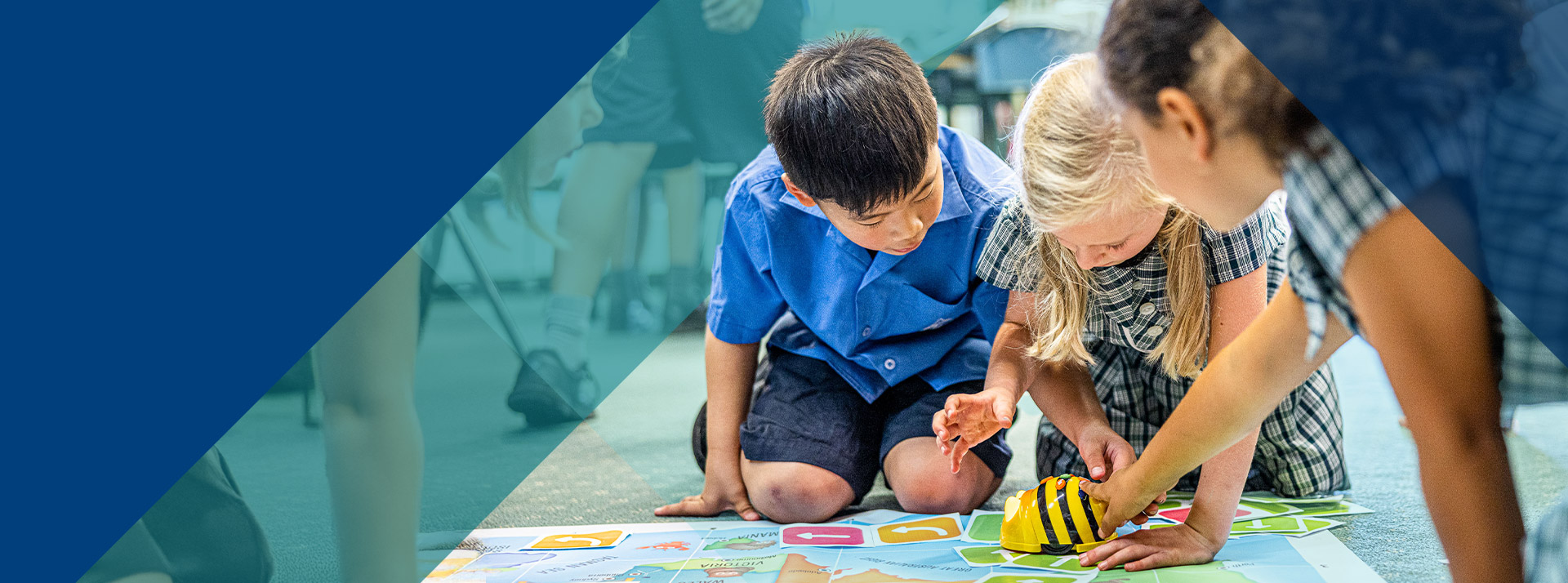 Students programming bee bots in the classroom at Our Lady of Lourdes Primary School Baulkham Hills South