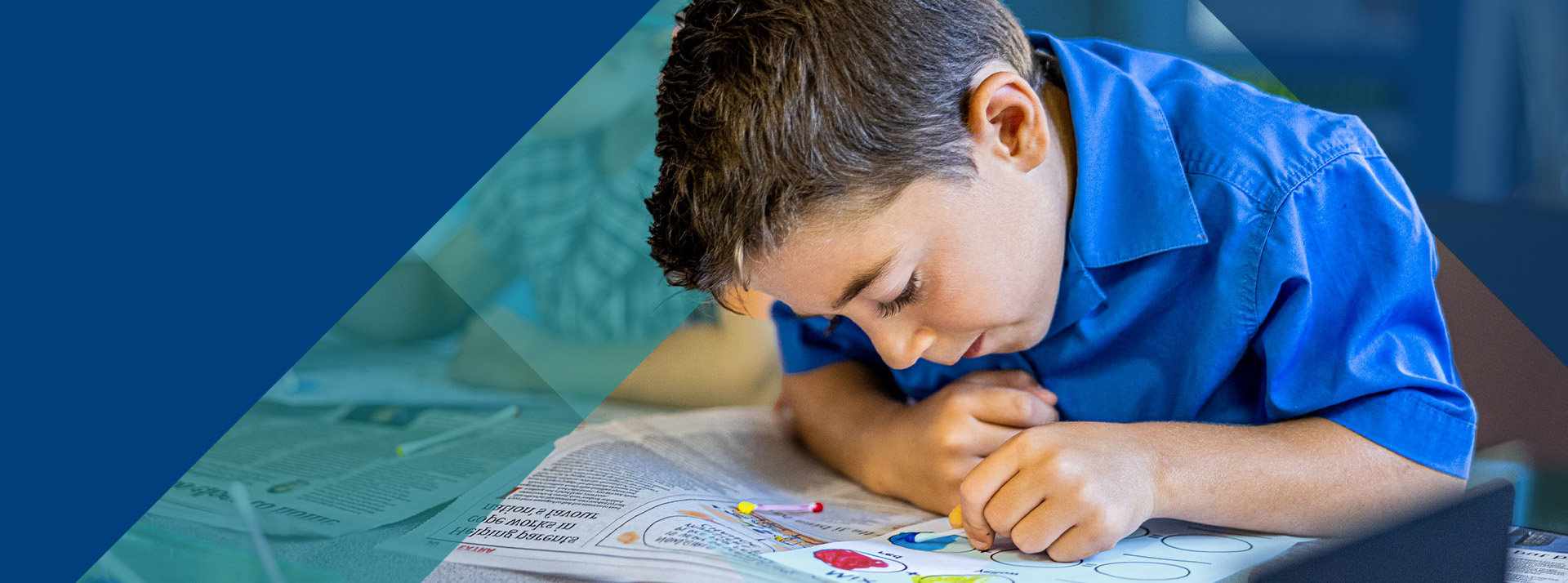 Student painting in the classroom at Our Lady of Lourdes Primary School Baulkham Hills South