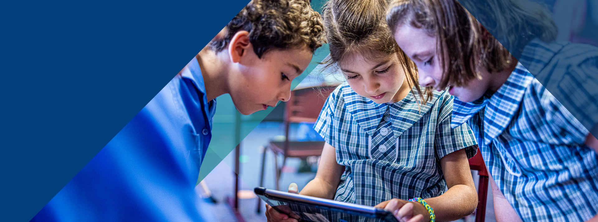 Students learning on their tablet together at Our Lady of Lourdes Primary School Baulkham Hills South