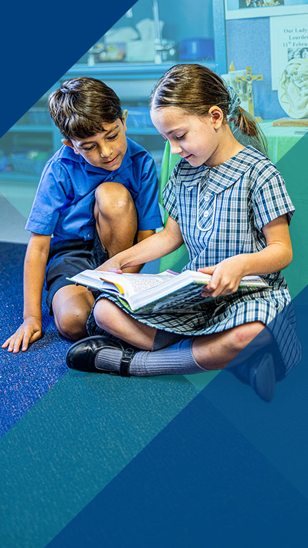 Students reading together in the classroom at Our Lady of Lourdes Primary School Baulkham Hills South
